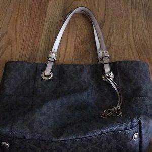 A brown logo Michael kors purse